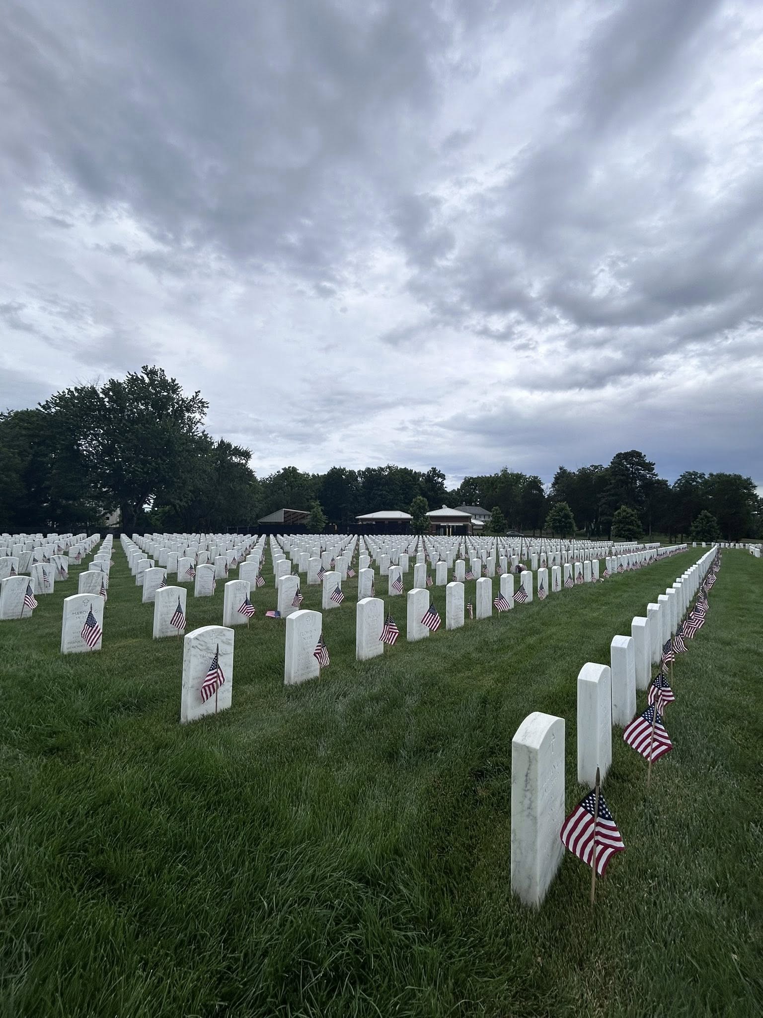 Volunteers place flags at Mountain Home National Cemetery for Memorial Day